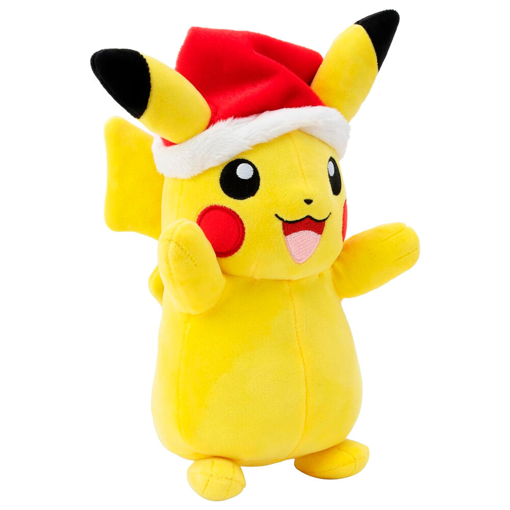 Peluche Pikachu de Noël assise montrant sa queue en forme d'éclair sur fond neutre