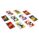 Enfants jouant au jeu de cartes UNO Super Mario Bros, concentrés et s'amusant en famille.