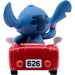Vue arrière de la figurine Stitch montrant les détails de son dos et ses ailes repliées