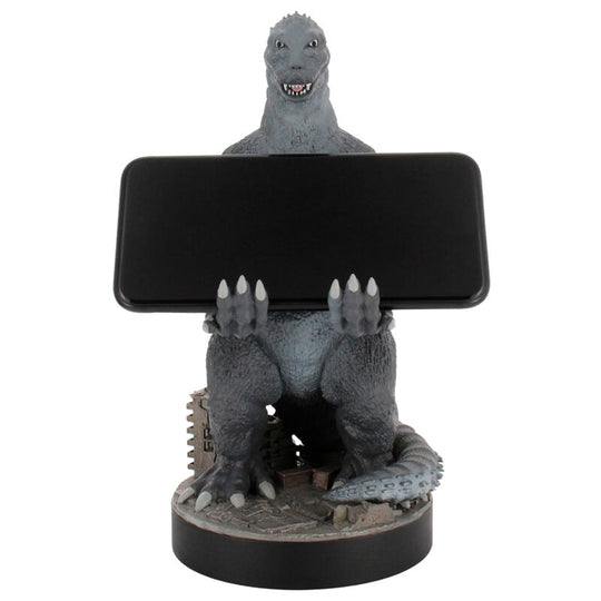Support Godzilla City Destroyer avec manette et smartphone alignés sur un bureau de gamer