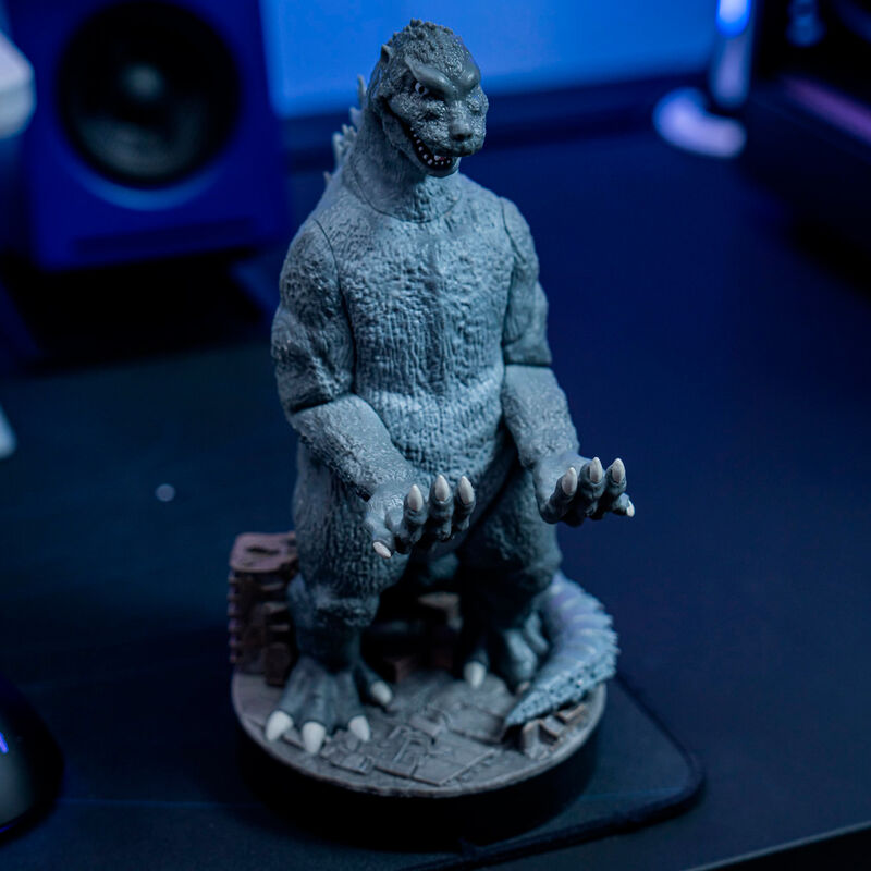Support Godzilla City Destroyer avec manette et câble de recharge non inclus visible