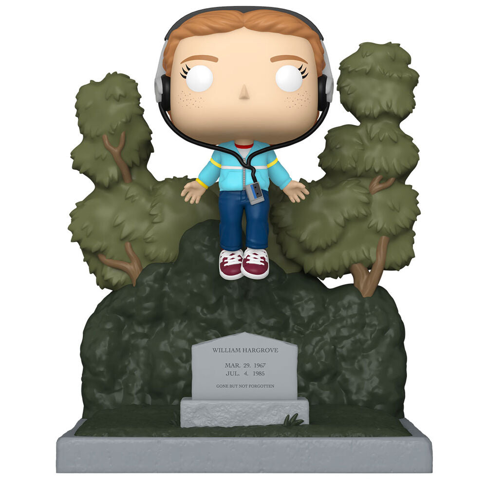 Figurine Funko POP Max de Stranger Things posée au cimetière, vue de face avec détails colorés et boîte cadeau en arrière-plan