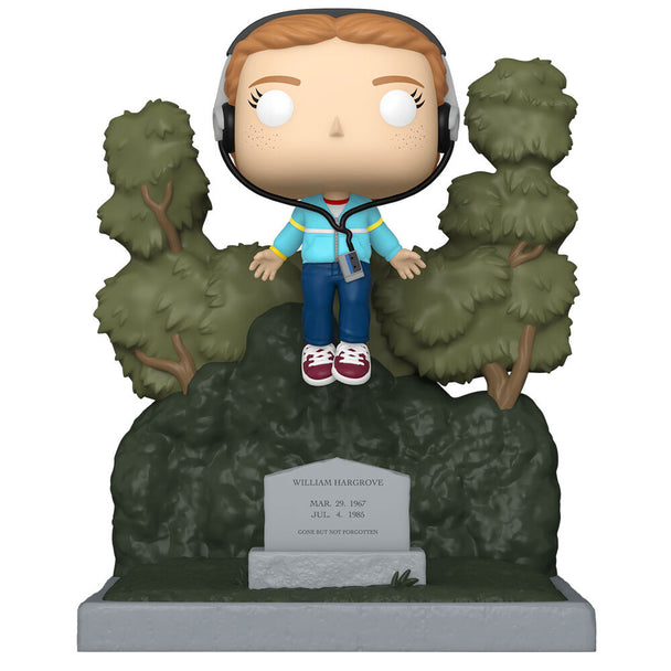 Figurine Funko POP Max de Stranger Things posée au cimetière, vue de face avec détails colorés et boîte cadeau en arrière-plan