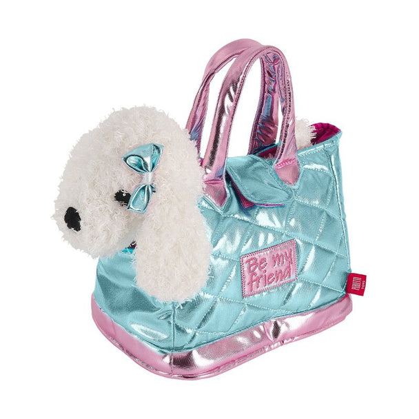 Sac Han Bag bleu avec peluche chien Didi posée sur une surface blanche, vue de face.