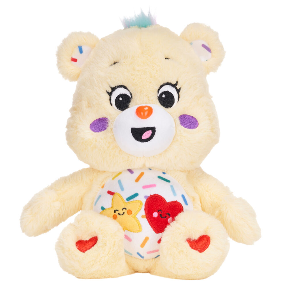 Peluche Care Bears Funny Bear colorée de 25cm, vue de face avec détails précis du visage et des couleurs vives.