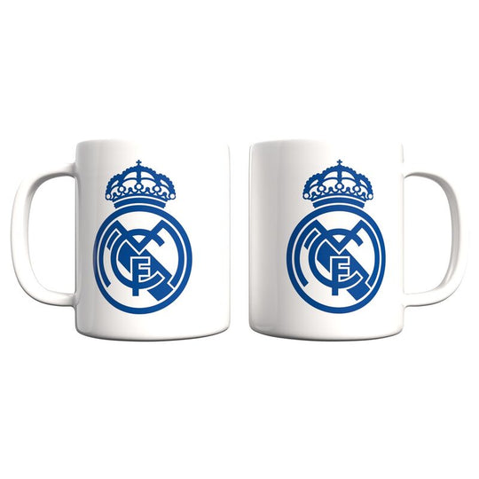 Mug céramique Real Madrid 330ml avec logo officiel, design blanc et détails bleus, compatible micro-ondes et lave-vaisselle.