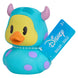 Canard en caoutchouc Disney rose avec robe à pois blancs, posé sur surface lisse