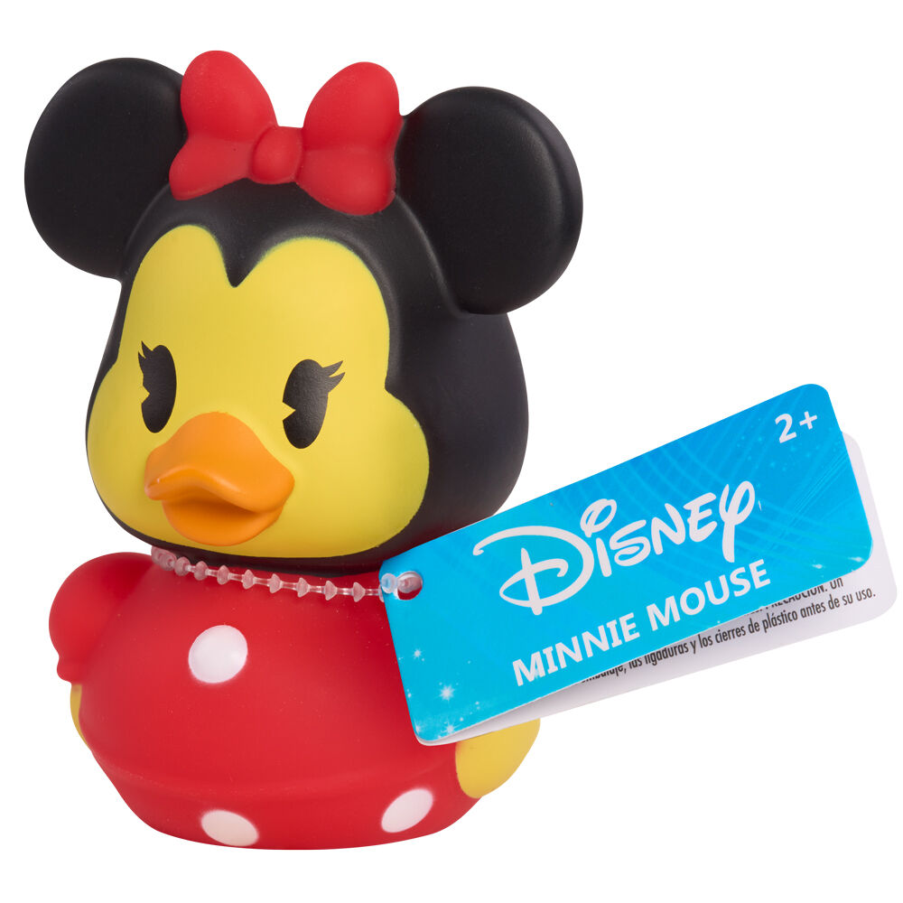 Canard en caoutchouc Disney blanc avec nœud papillon rouge, posé sur table en bois
