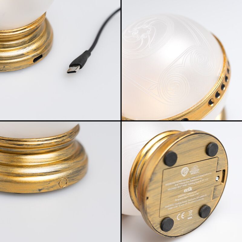 Lampe Remembrall Harry Potter avec lumière rouge activée, posée sur un bureau en bois