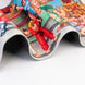 Gros plan sur les bords renforcés du tapis gaming Street Fighter ERIK pour une meilleure durabilité et résistance à l'usure.