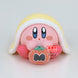 Gros plan sur le visage souriant de la figurine Kirby ver. B Break Time de BANPRESTO
