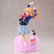 Profil latéral de la figurine BANPRESTO Ruby montrant les détails du costume et la posture dynamique