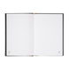 Intérieur du cahier ERIK avec couvertures personnalisées visibles, apportant une touche unique.
