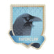 Bouteille en verre en forme de potion contenant le puzzle Ravenclaw, avec un bouchon en liège visible sur le dessus.