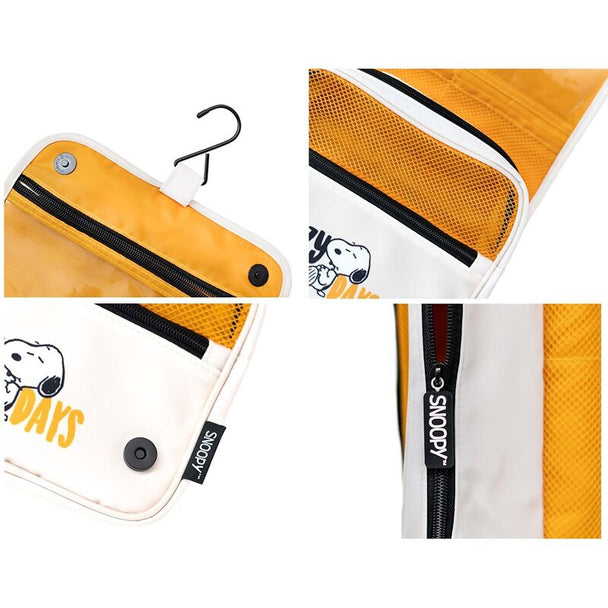 Vue rapprochée du tissu imperméable en polyester et des fermetures éclair robustes de la trousse Snoopy ERIK