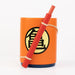 Stylo amovible inspiré du nyoibou de Goku posé à côté du porte-crayons Dragon Ball Z