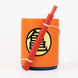 Stylo amovible inspiré du nyoibou de Goku posé à côté du porte-crayons Dragon Ball Z