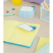 Présentation des trois blocs-notes Disney Stitch disposés côte à côte sur un bureau clair, mettant en valeur leur design et taille compacte