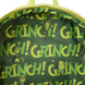 Sac à dos Loungefly Grinch porté par un modèle dans un décor hivernal