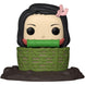 Figurine Funko exclusive de Nezuko Kamado en position assise dans son panier, avec une vue latérale mettant en valeur les couleurs et la finition.