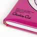 Vue rapprochée du sourire du Cheshire sur la couverture du cahier CERDÁ