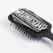 Brosse Wednesday CERDÁ posée sur une surface claire, mettant en avant sa forme compacte