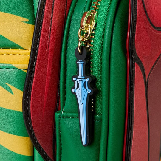 Vue latérale montrant les panneaux décoratifs verts et jaunes et les finitions en métal doré du sac à dos