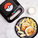 Sandwich grillé avec motif Pokéball imprimé grâce à la presse à panini Pokémon