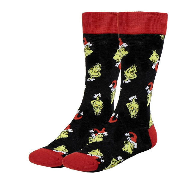 Zoom sur les chaussettes Grinch en coton doux, mettant en avant la qualité des matériaux utilisés