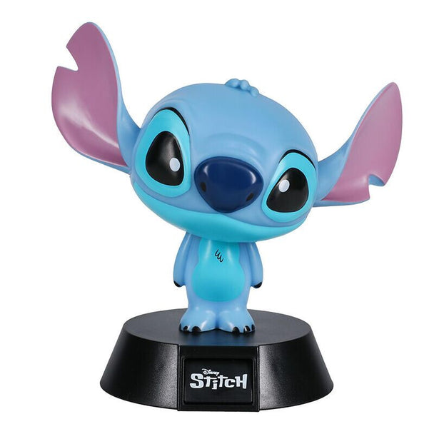 Lampe Stitch Disney 12cm allumée sur une table de chevet dans une chambre d'enfant.