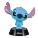 Lampe Stitch Disney 12cm allumée sur une table de chevet dans une chambre d'enfant.