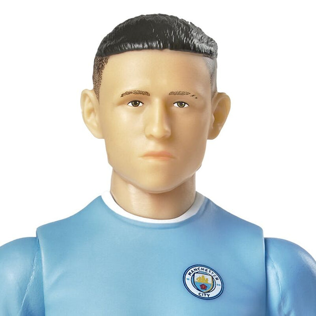 Pose dynamique de la figurine Phil Foden en action avec ballon de football