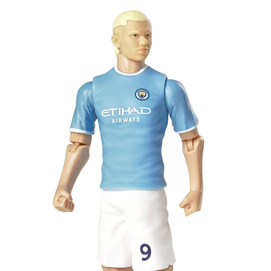 Vue de profil de la figurine Haaland Manchester City avec détails du maillot