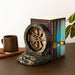 Serre-livres Harry Potter Chambre des Secrets présenté sur un bureau décoré