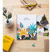 Vue de l'album photo ERIK ouvert avec plusieurs photos insérées au format 13x20cm