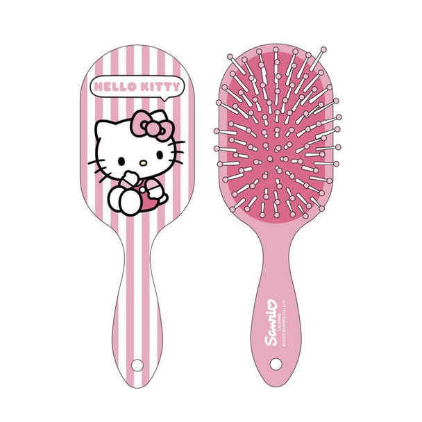 Détail de la brosse Hello Kitty CERDÁ montrant les picots en plastique et le logo sur le manche
