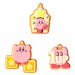 Zoom sur le visage souriant de Kirby sur le porte-clés coloré
