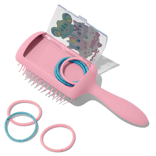 Gros plan sur la brosse Sweet Dreams avec ses poils doux et son manche adapté aux petites mains d'enfant.