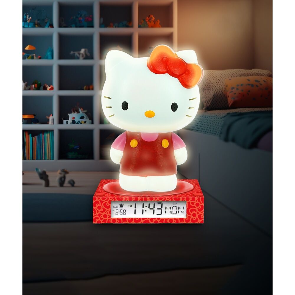 Lampe Hello Kitty 3D allumée sur une table de chevet dans une chambre d'enfant