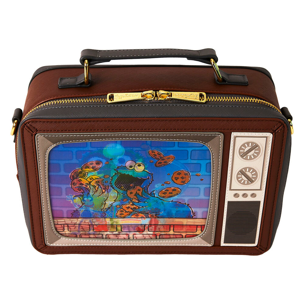 Zoom sur les finitions dorées brillantes et les détails embossés du sac Sesame Street.