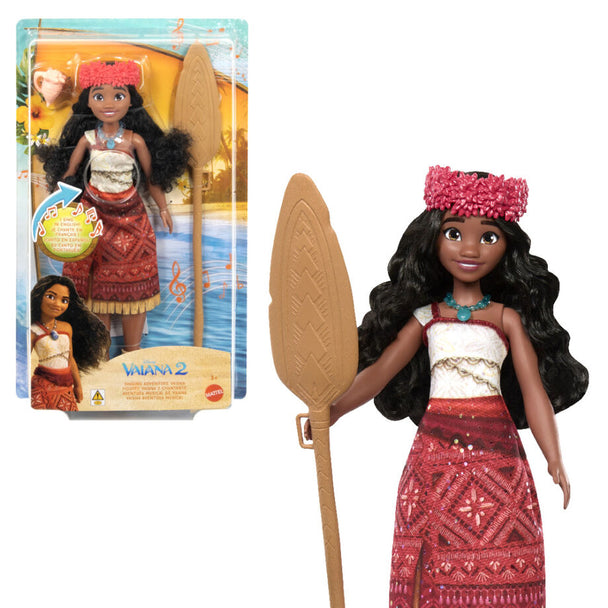 Poupée Vaiana chantante Disney MATTEL en tenue d’aventurière avec accessoires colorés sur fond blanc.