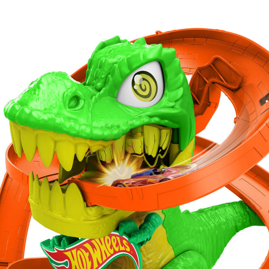 Zone de rangement intégrée pour les voitures supplémentaires sur le circuit Hot Wheels City T-Rex Blaze Battle