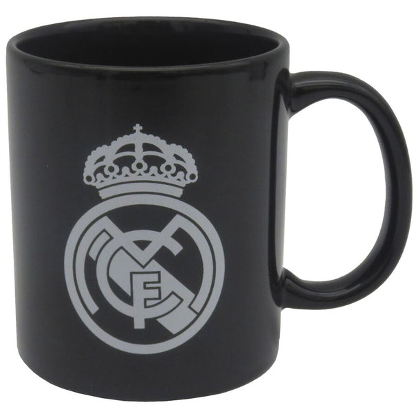 Mug en céramique blanc avec logo officiel du Real Madrid, capacité 330ml, présenté sur fond blanc.