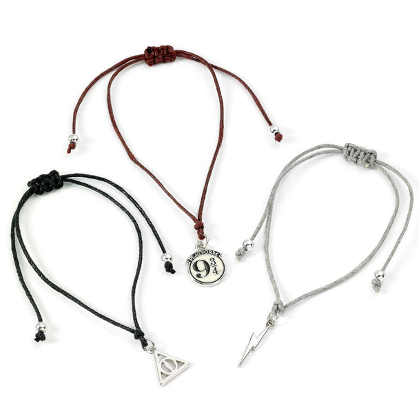 Set de 3 bracelets Harry Potter avec symboles quai 9 3/4, éclair et Reliques de la Mort sur fond blanc