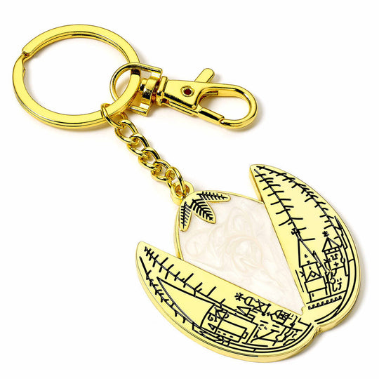Détail du porte-clés œuf d'or Harry Potter montrant la texture et l'attache en métal robuste