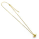 Collier Harry Potter avec pendentif Golden Snitch dorée sur fond blanc, chaîne fine de 40 cm