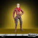 Accessoires inclus : blaster court et blaster long posés à côté de la figurine Cobb Vanth
