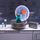 Logo MGA sur l'emballage des capsules surprises Jurassic Park Miniverse