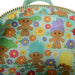 Sac à dos Loungefly Trolls Retro porté par un modèle en extérieur, illustrant son style tendance