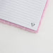 Cahier Disney Minnie ouvert montrant les pages lignées prêtes à être utilisées